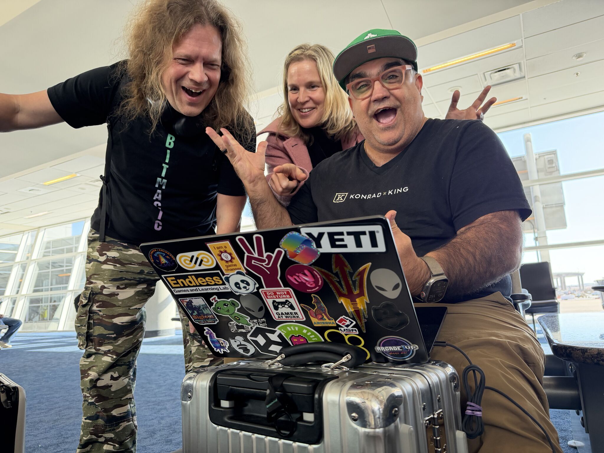Jani Penttinen, Elina Ollila and Mark Ollila vibe coding together at dallas fort worth international airport DFW